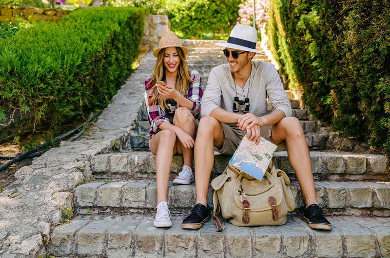Man and woman sitting on stairs